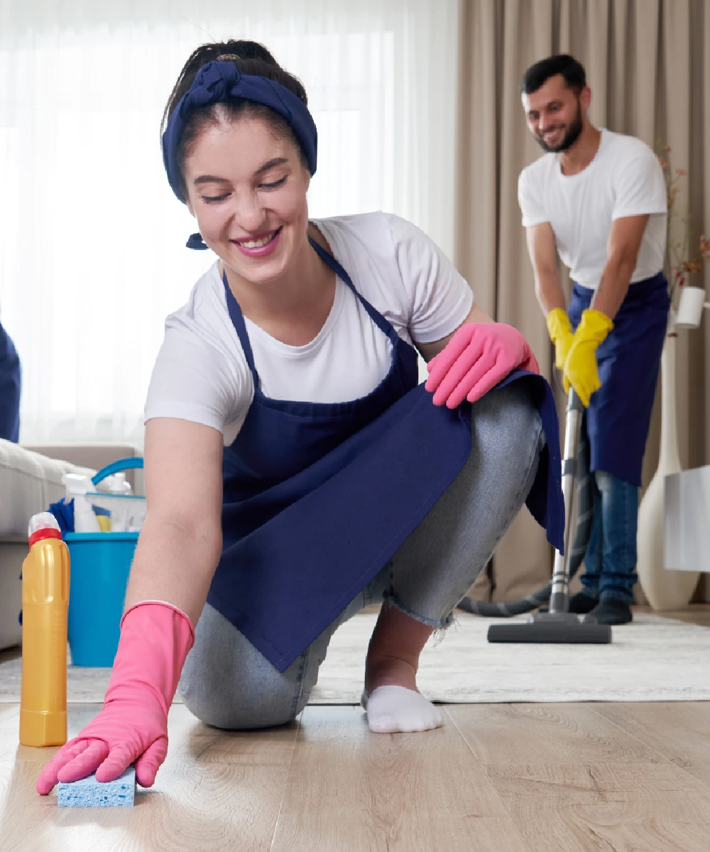 Manager inspecting a cleaned apartment room with a checklist